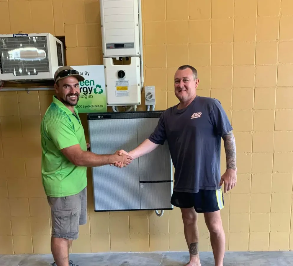 Happy residential solar customer shaking hands with Green Energy Technologies installer. Leaders when it comes to home solar.