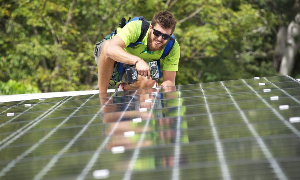 Man doing installation of solar for home
