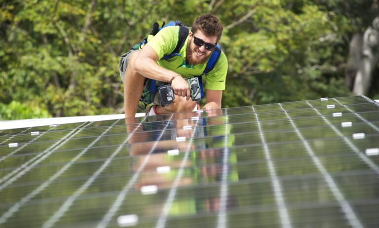 Solar Battery Rebate Calculator Man doing installation of solar for home